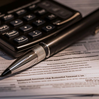 Tax form and pen reveal financial success generated by artificial intelligence, Tax form and pen reveal financial success generated by artificial intelligence