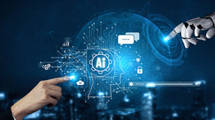 Human and robot hands pointing to AI logo Hands typing on a keyboard with an AI logo representing agentic AI