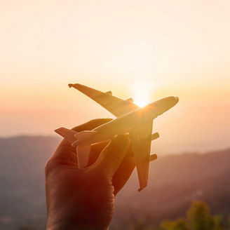 Hand holding toy plane
