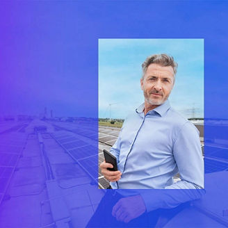 Man leaning on solar panels