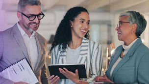 3 people talking in office