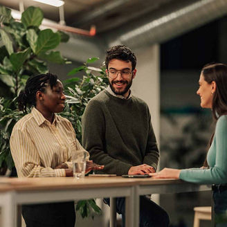 Business colleagues brainstorming in a modern, eco friendly office representing EBA 2027 stress test