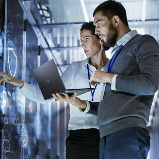 2 people using digital screen representing EU AI Act: From Regulation to Reality