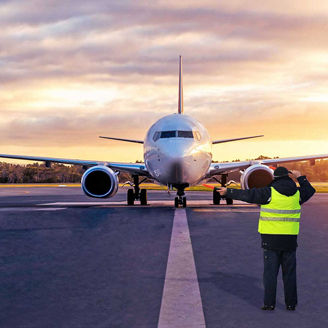 Man on runway directing plane representing Evolving Asset Management Regulation 2026