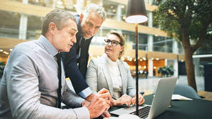 3 people in meeting representing domestic business
