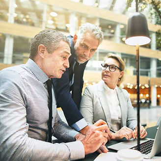 3 people in meeting representing domestic business