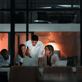 People in business meeting after dark representing financial services