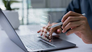 Person doing taxes on laptop representing indirect taxes
