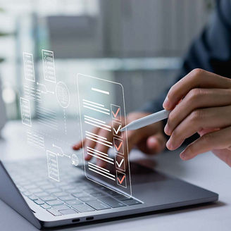 Person doing taxes on laptop representing indirect taxes