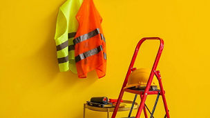 Hard hats and vis vests representing property and construction