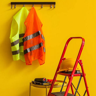 Hard hats and vis vests representing property and construction