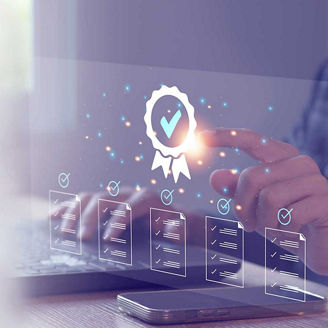 Hands using laptop with quality overlaid representing Why FRS 102 updates are a boardroom issue, not just for the auditors