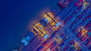 Freight ship in harbour at night