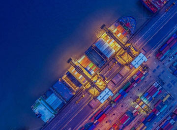 Freight ship in harbour at night