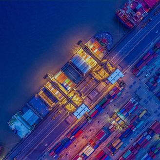 Freight ship in harbour at night