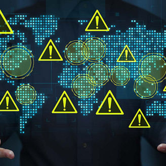 Geopolitical risks and instability in international relations. Assessing the impact of international conflict and trade war. Business person holding a world map and warning triangle icons.
