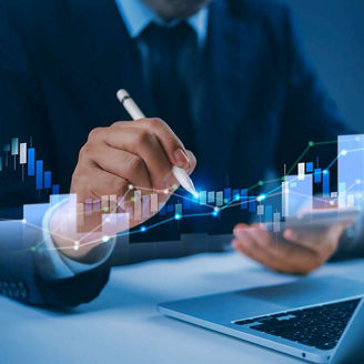 Man using stylus and laptop representing scale with confidence