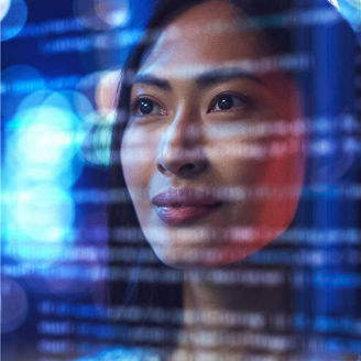 Woman looking at code on screen