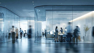 Workers in glass office representing infrastructure and programme assurance