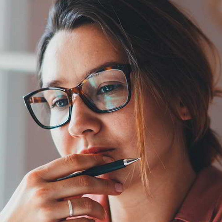 Woman reading, deep in thought