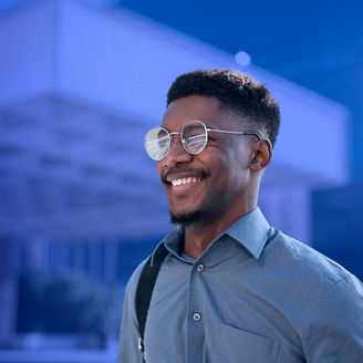 Man smiling into distance