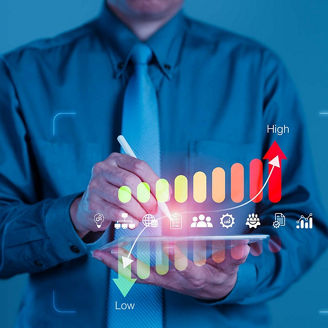 A man points to a risk indicator on a tablet