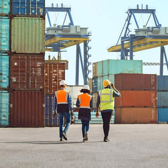 3 engineers in shipyard representing Ireland's revised ports policy