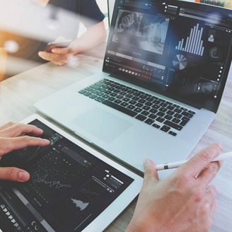 Hands typing on laptop