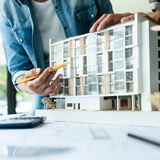 Group of engineer is discussion and brainstorming about condominium model of construction project.