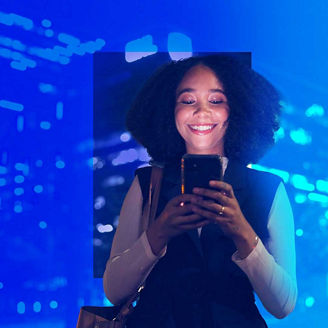 Smiling woman using mobile phone