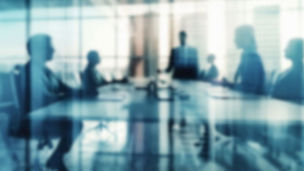 Blurred executives in meeting room
