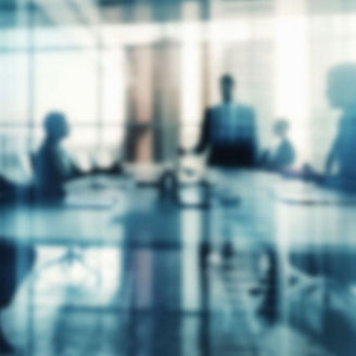 Blurred executives in meeting room