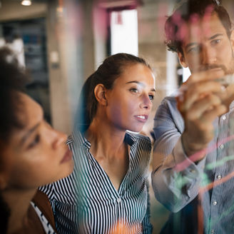Programmers working cooperating at IT company developing apps