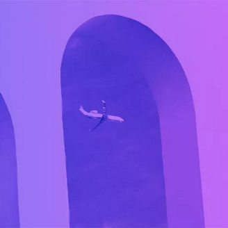 Plane seen through building arches