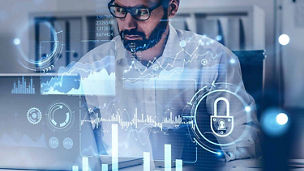 Man looking at laptop with icons overlaid representing regulatory transformation