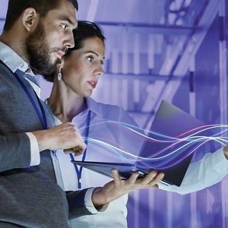 Two people looking at interactive wall