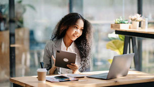 Executive working in office representing technology media and telecoms client success stories