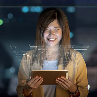 Woman smiling at tablet