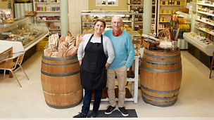 2 shopowners in shop representing business tax