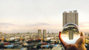 Tower block reflected in globe
