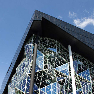 Venture Pulse Q4 25 - modern angular building set against blue sky