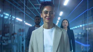 3 people in office with neon lines overlaid