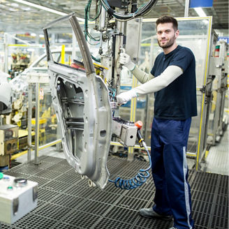 Portrait of confident worker in modern car factory