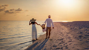 impact-plan-family-walking-along-beach