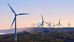 A landscape with a series of wind turbines