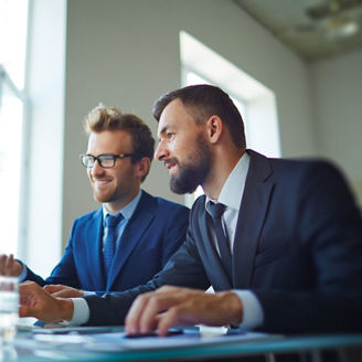 Businessmen working with computer in team