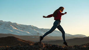 A woman jumping in the nature