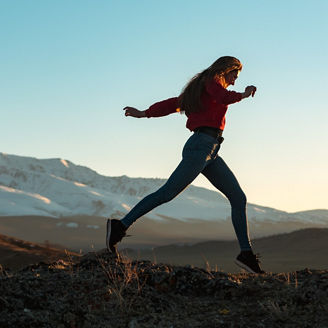 A woman jumping in the nature