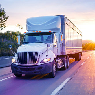 panoramic shot of cheerful diplomats smiling while looking at each other 