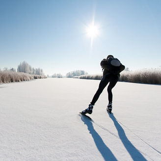 Skier skating in snow